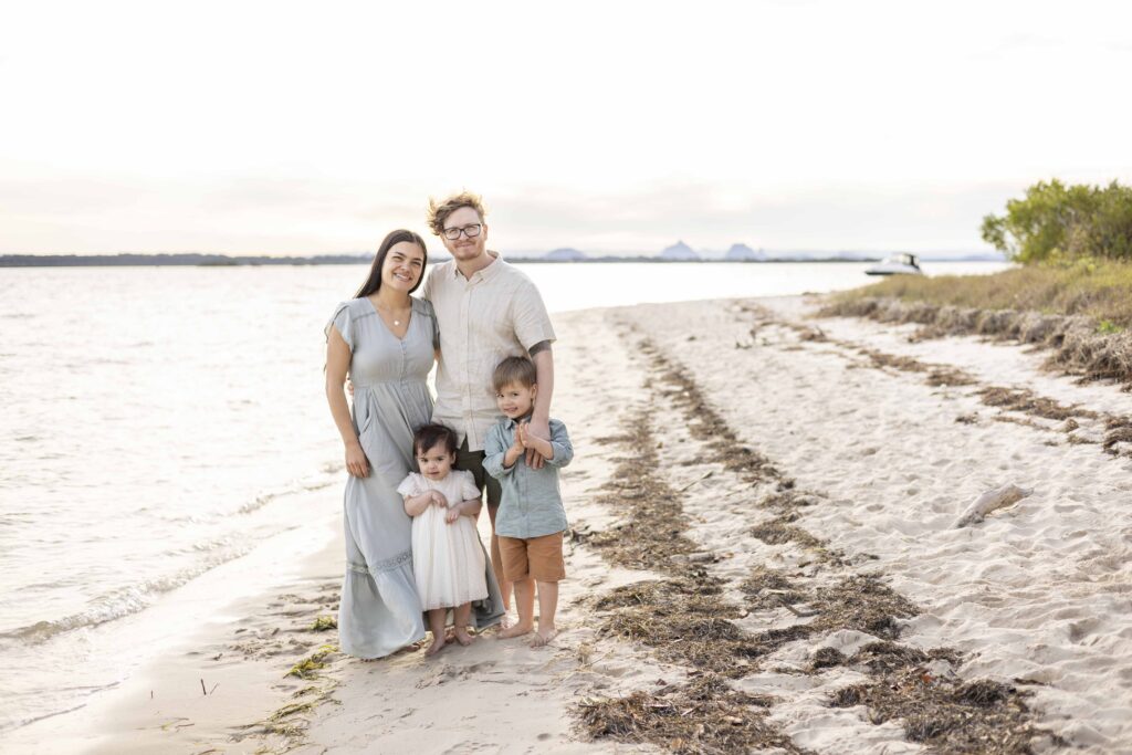 Family Portrait of a family of four, on a beautiful beach on Bribie Island. By Sharon Joseph Photography, Brisbane Family Photographer.