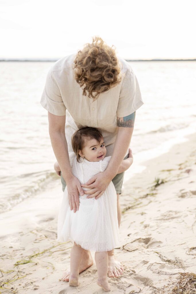 Little girl hugging her daddy's legs | Brisbane family photography | Sharon Joseph Photography