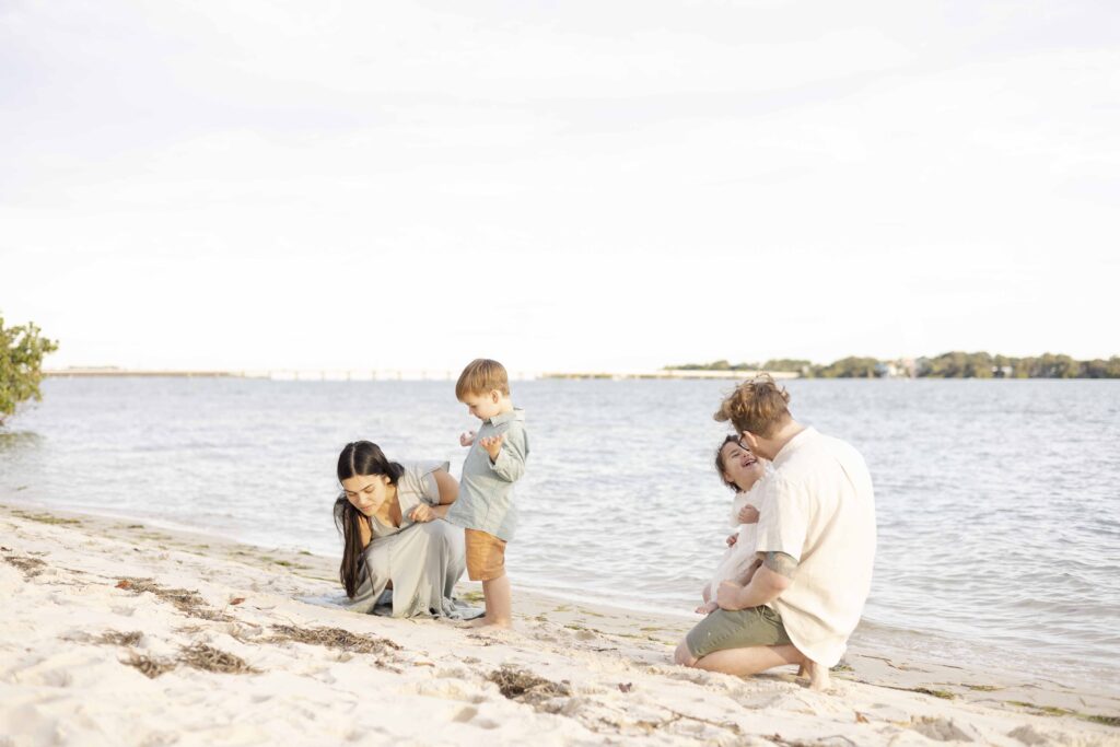 Light and Airy Family Photography Brisbane | A candid photo of a family on a beach in Brisbane | Sharon Joseph Photography