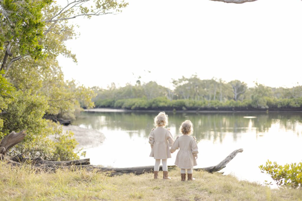 Two little girls watching the river in Brisbane.