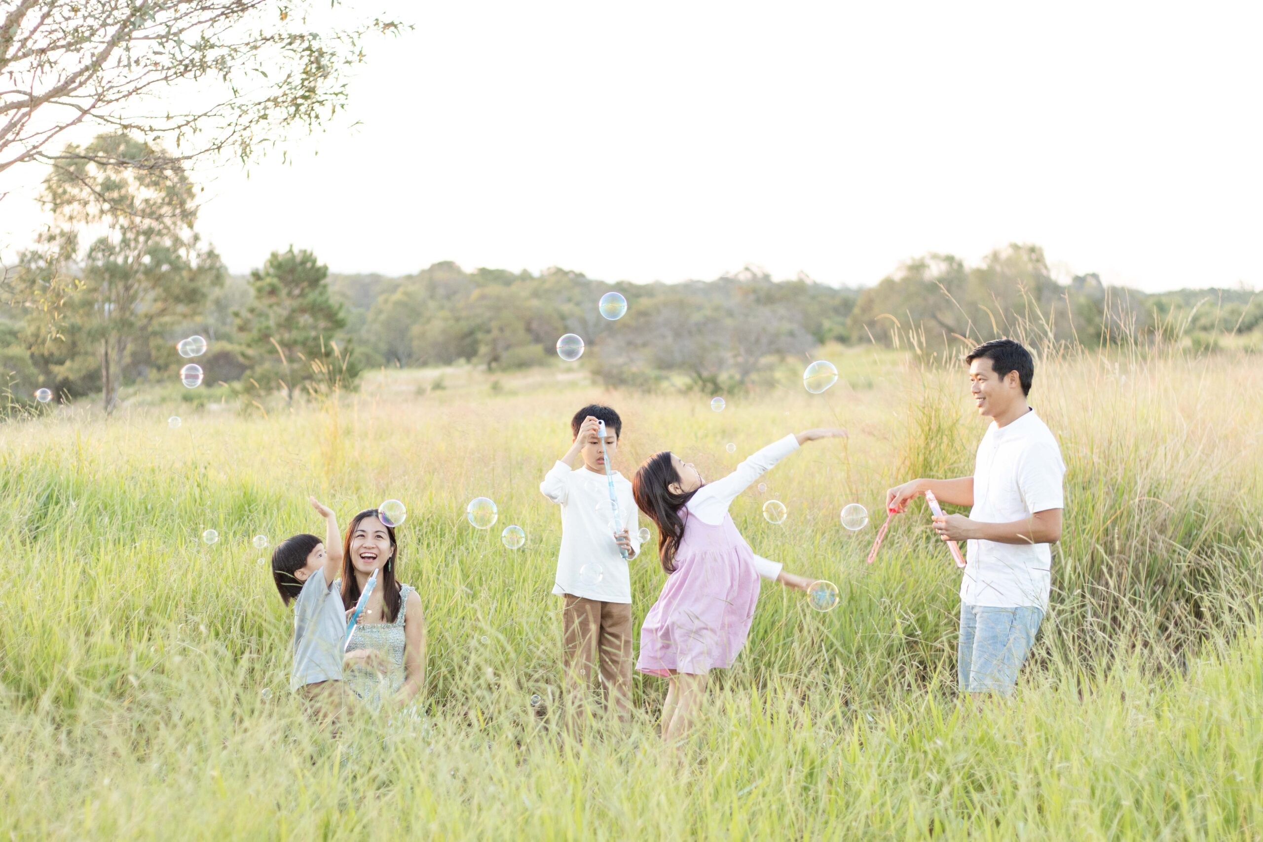 Family enjoying playing with bubbles