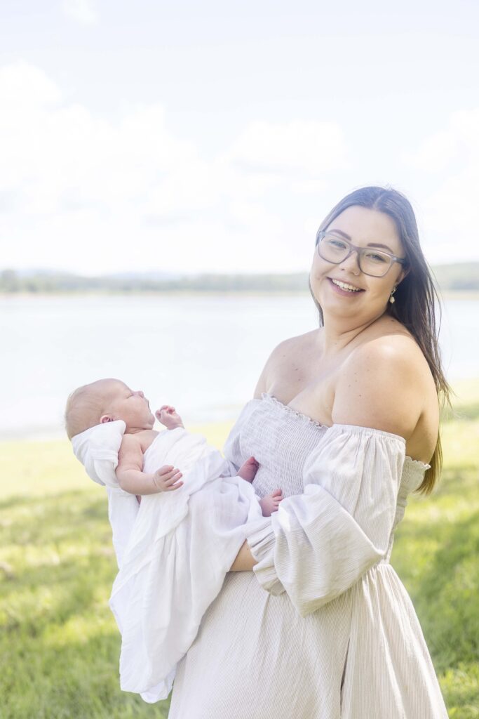 Happy Mum holding her newborn baby