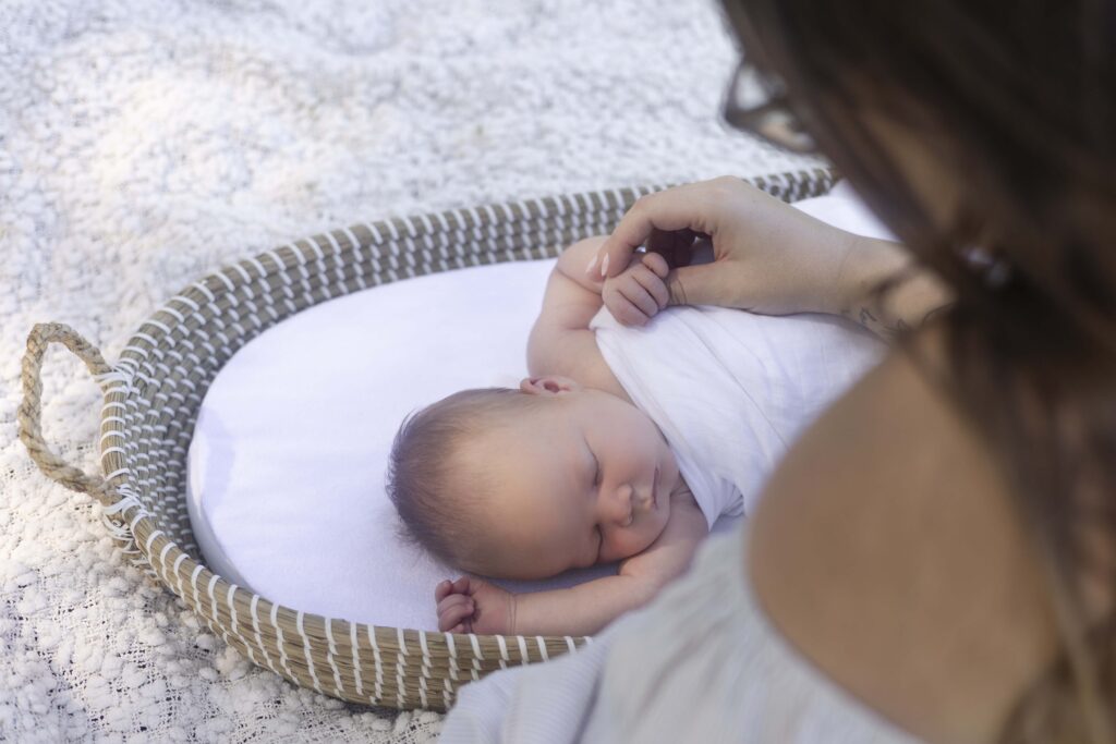 mum holding newborn's hand