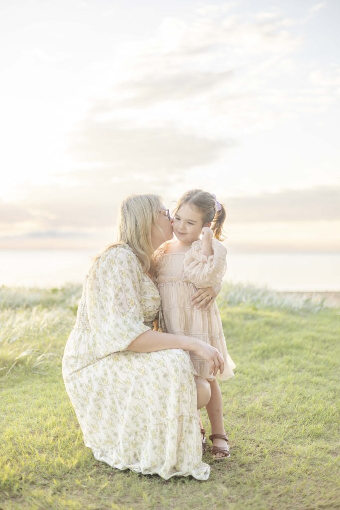 Mum kissing daughter | Sunrise Beach Photoshoot in Scarborough Brisbane | Sharon Joseph Photography