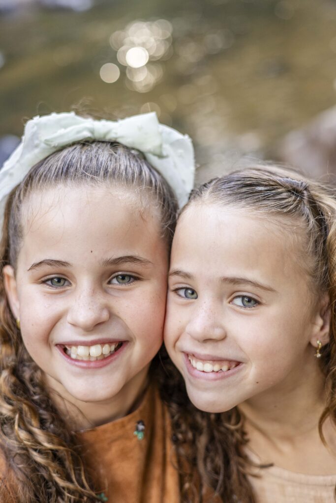 Close up photo of two young sisters